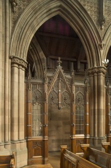West transept. Screen and arch leading to west entrance.