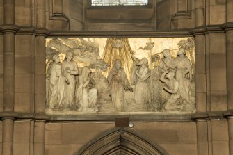 Chancel. Marble panel on north wall.