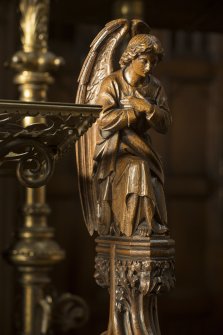 Chancel. Detail of carved angel on end of choir stall.