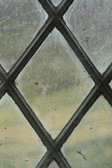 East window. Detail of writing etched on glass. (Image reversed for legibility.) 'May 24 1845'
