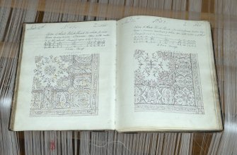 Interior. Jaquard loom in gallery area. View of design book for Jaquard loom
