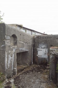 No. 1, 6-inch gun emplacement. NW platform showing light recess, cartridge locker and hatch of the cartridge hoist. View from NW.