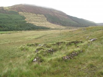 View of two buildings, looking E