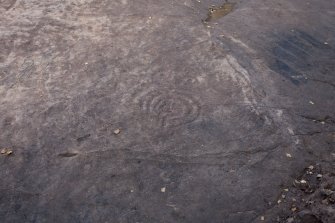 Detail of cup and ring marks and grafitti.