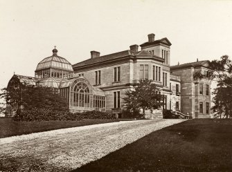 View of front of Barshaw House with large palm house.