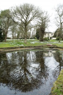 General view of Castlehill Farmhouse gardens and  former curling pond, taken from the south east.