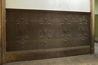 1st floor, corridor to south, detail of embossed wall covering