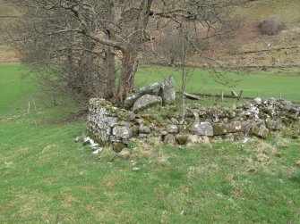 View from SW showing post-medieval building and remnants of cairn beyond