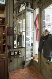 Retail area. Glazed door to secondary display window.