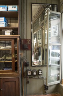 Retail area. View of shopfittings and brass light fittings