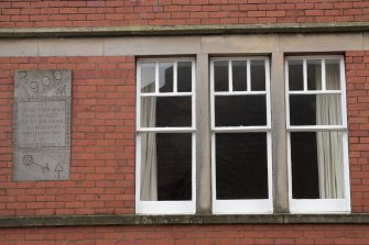 Detail of window and plaque.