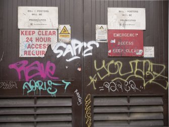 Graffiti tags on electricity sub station doors, taken from the south.