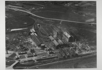 Copy of aerial photograph of Provan Works showing purufier house and oxide store (left), the original 1903 horizontal retort house (with 4 chimneys) and the 1921 vertical retort house (right). Coal stores are the low buildings beyond. Coke store is at south end of the site low level railway sidings (bottom right).