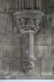 Sacristy, detail of corbel with figures holding beehive