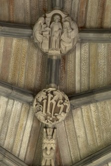 Choir, ceiling, detail of carved boss (Boy Jesus in Temple)