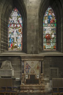 Crossing, north transept, view of war memorial with stained glass above