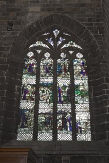 Crossing, north transept, view of stained glass window on west wall