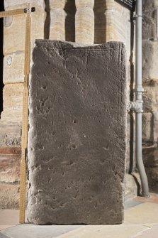 Smaller Pictish slab, view of front face with traces of carving (including scale)