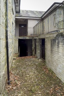 General view of space between original house and extension.