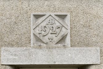 Detail of 1927 date stone above entrance door.