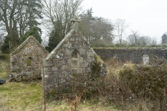 General view of remains of small chapel outside East wall of garden.