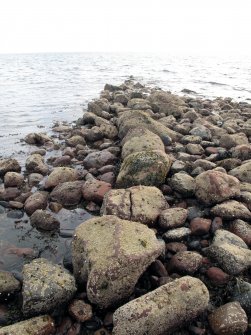 View of boulder wall on west side of harbour, looking south-west.