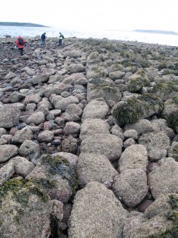 View along boulder wall that forms north edge of harbour, looking west.