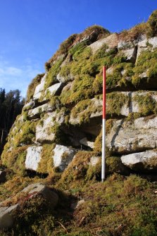 Missing blocks in the outer wall face at Point E, facing N