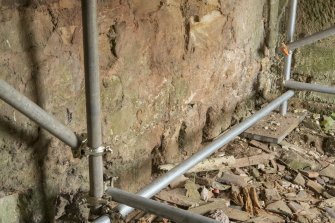 Internal. Ground floor. South wall. View of floor joist holes from north east.