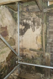 Interior. Ground floor. Detail of possibly original plaster on walls.