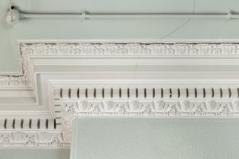 Ground floor. South west office. Detail of cornice.