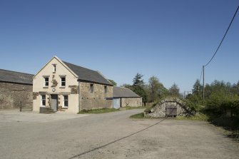 General view of  reservoir/ ice house and farm, taken from the south west.