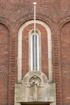 North front. Detail of carved figure.