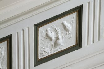 Main stair. Detail of plaster wildlife panel.