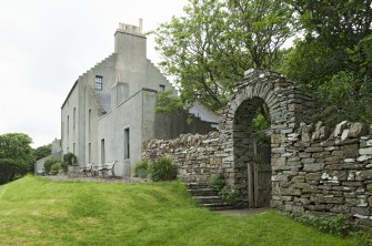 House and arched gateway, view from south