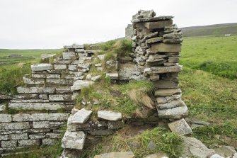 Garderobe chute, view from south showing later stone dyke to right