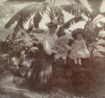 Woman and children seated on a wall, titled 'Mrs Edmonds, Walter, Lorna'; 'Glen Lorne, Rhosdesia 1907'. 
PHOTOGRAPH ALBUM NO.116: D M TURNBULL
