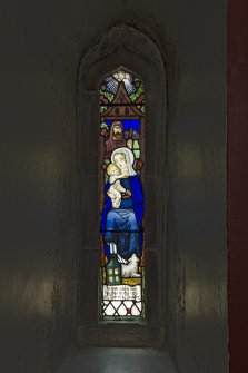 Under gallery area, detail of small stained glass window