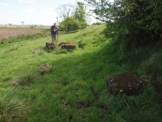 Allan Kilpatrick surveying the more westerly of the concrete blocks to the N of the hedge