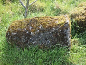 A tapering concrete block with an expanded summit - right