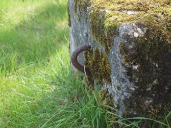 The asymmetrical iron loop in a concrete block