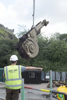 Buttress being removed by crane
