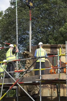 Detail of buttress being lifted by crane