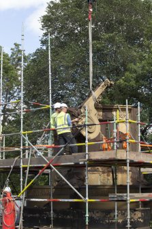Detail of buttress being lifted by crane