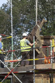 Detail of buttress being lifted by crane