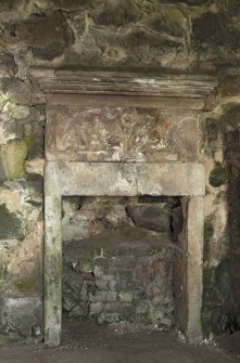 Vaulted room on ground floor, detail of fireplace on north wall