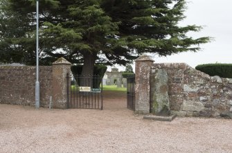 View of entrance to churchyard with Strathmiglo Pictish symbol stone on right