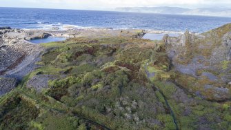 Oblique aerial view from south east showing Klondyke Quarry (right) with An Lub Chlear and An Toll mar Luaty quarries beyond, Fang Quarry (left) and walled garden enclosures which pre-date the quarries in this area.