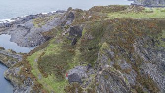 Oblique aerial view from south showing the western quarries An Lub Chlear and An Toll Mar Luaty and the ruins of the boiler house (foreground), engine house and forge associated with these quarries.