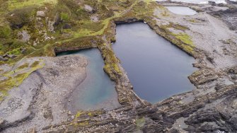 Oblique aerial view of An Toll Mar Luaty and An Lub Chlear quarries from the west.